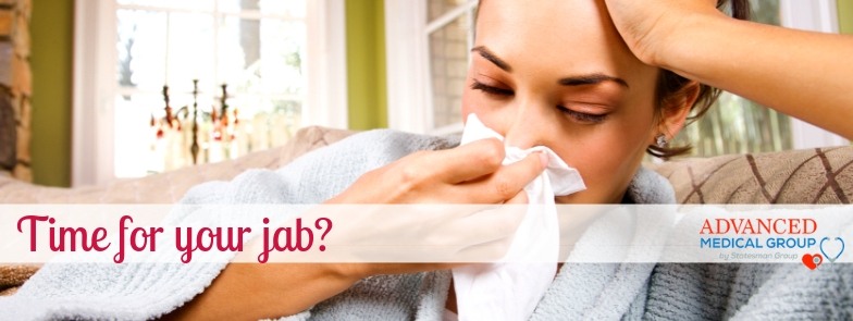 Woman blowing nose with cold she needs a flu shot
